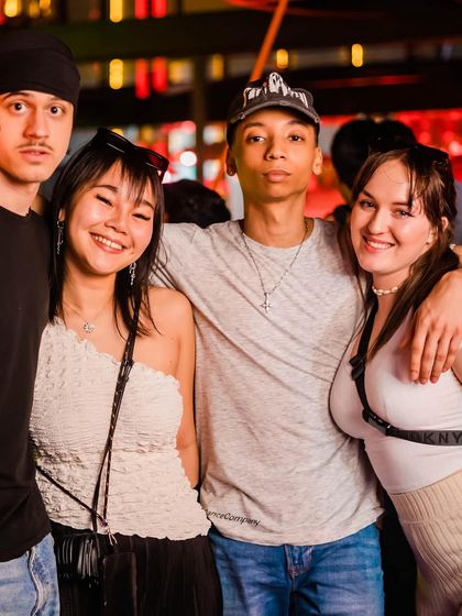 A diverse group of friends from around the world, united by music.