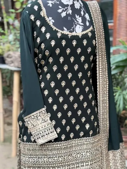 The kurta has beautiful buti work all over, with a heavily embroidered neckline and sleeves.