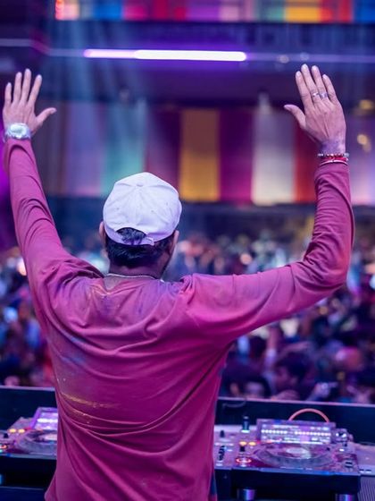 Hands up for the crowd at the Holi festival. Connecting with thousands of people at once is an unmatched feeling. This was one of the best Holi events, a true festival of colors and music.