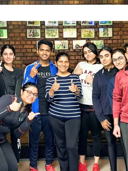 A group photo of our happy and motivated shooters after a successful training camp. The camaraderie and shared goals are a huge part of our academy's culture.