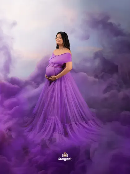 Floating on a cloud of purple smoke, this portrait creates a dreamy and ethereal mood. The off-shoulder purple gown adds to the romantic feel.