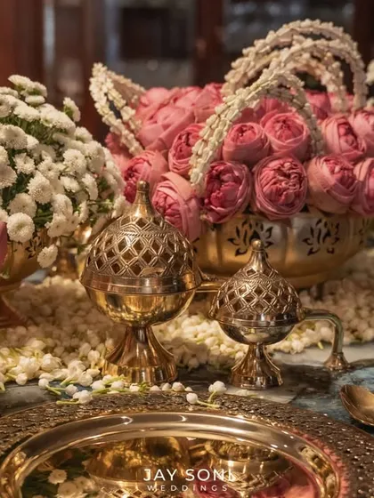 I believe luxury is found in the details that touch your guests directly. This exquisite tablescape, with its traditional brassware and lush arrangements of pink roses and lotuses, was designed to make every guest feel honored and cherished.