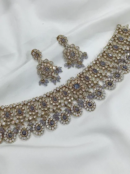 A grey stone choker with an antique finish.