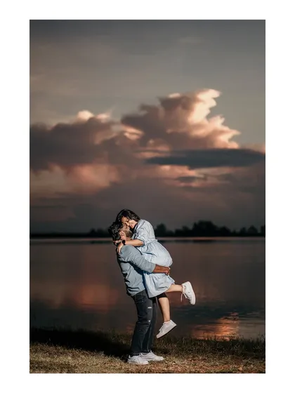 Capturing the pure joy and romance of a golden hour lift against a dramatic sunset sky. These are the moments that feel like they're straight out of a movie.