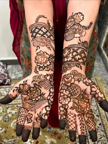 A playful and modern Indo-Arabic design. The patterns are asymmetrical, with different motifs on each hand, creating a unique and stylish look.