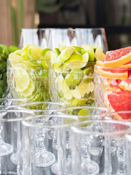 Our bar prep, showcasing glasses filled with fresh mint, lime, and grapefruit, ready for a day of crafting delicious cocktails and mocktails.