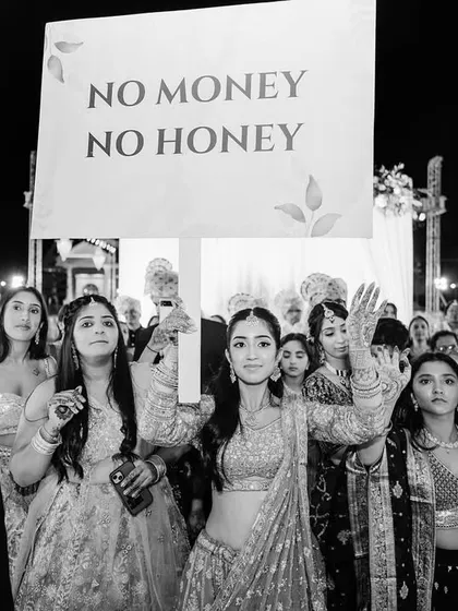 Weddings are full of fun and inside jokes. My documentary approach means I’m always ready to capture those hilarious, candid moments, like the bridesmaids' playful message during the baraat.
