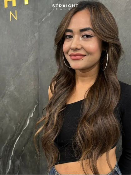 A happy client with her new free-spirited hair.