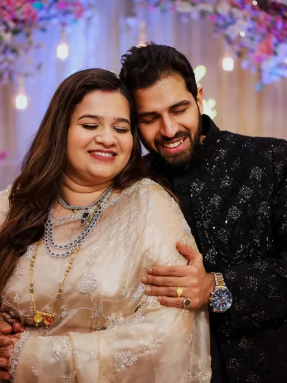 A warm, affectionate portrait of Mrunal and Prachiti. The soft lighting and genuine smiles make this a truly heartwarming wedding photograph.
