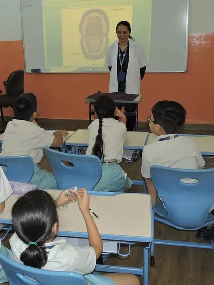 A teacher conducts a session on dental hygiene as part of our "Community Konnect" program. We believe that teaching personal hygiene is fundamental to a child's overall well-being.