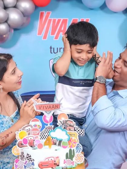 A classic 'Cinderella' themed birthday party, featuring a grand castle backdrop, elegant blue and white decor, and a custom carriage prop, making every little girl feel like a princess.