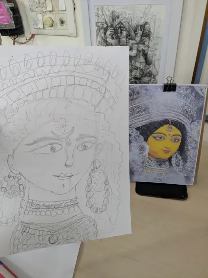 A close-up of the initial pencil sketch next to the reference image. This shows the careful planning and drawing that goes into a detailed painting.