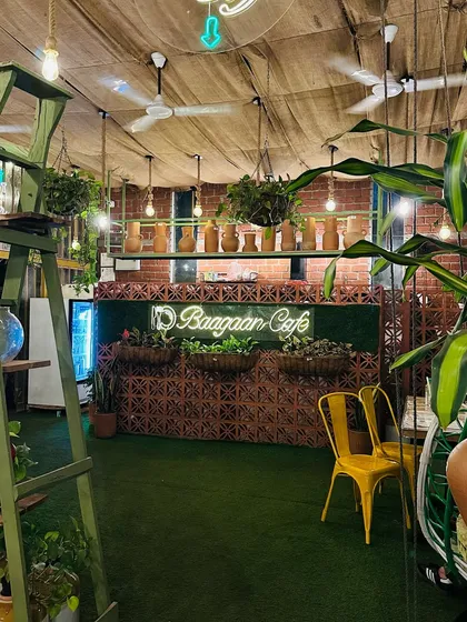 A view of our counter area, where the green turf floor meets the warm brick wall. I wanted every part of the cafe to feel connected to nature.