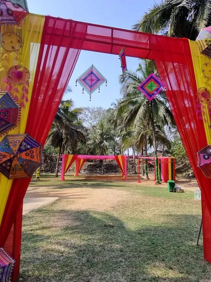 We also design for vibrant corporate events. This colorful entrance arch, decorated with traditional Rajasthani umbrellas and bright drapes, was created for a festive Holi celebration for our client, GIVA.