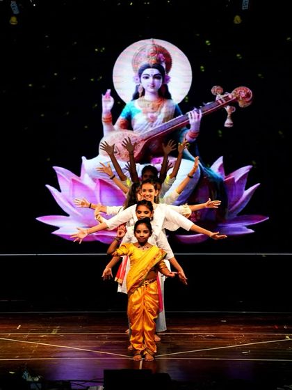 A beautiful and serene moment from our Devi Maa prayer act. This semi-classical performance features our younger students in a graceful formation, paying homage to Goddess Saraswati.