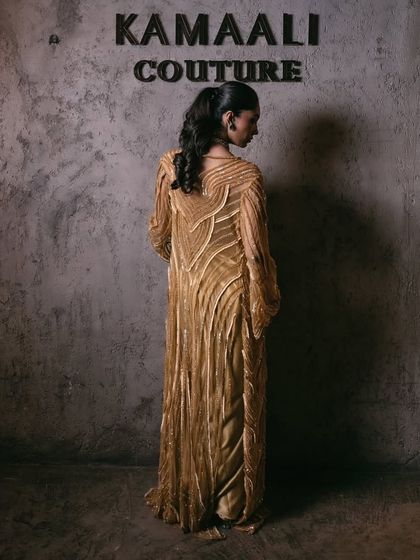 The back of a hand-embellished jacket, designed to be worn over a corset gown. This piece showcases my signature embroidery, a timeless symphony of structure and sparkle.