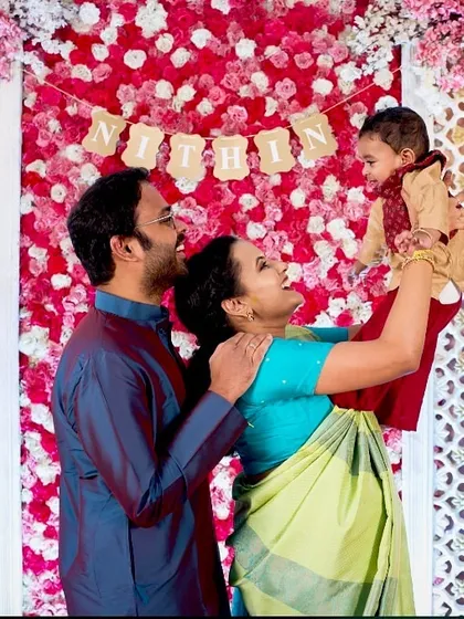 Welcoming a new life is a precious milestone. For this naming ceremony, I created a beautiful floral wall backdrop in pink and white, providing a perfect, joyful setting for the family's first official photos with their baby.