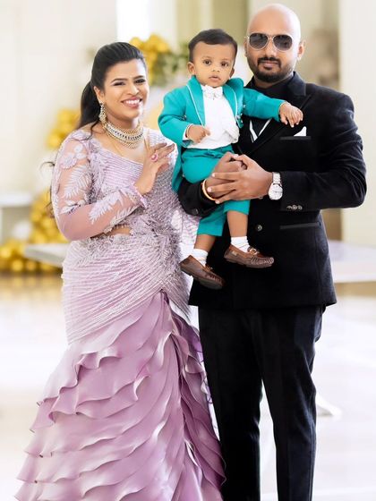 A modern take on occasion wear. This woman looks radiant in a lavender ruffle drape gown, celebrating with her family. It shows how my designs can be both high fashion and perfect for creating happy memories.