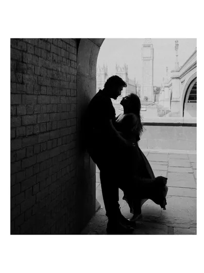 A silhouette of love against the London skyline. This black and white portrait of Akhil and Merlin is moody and romantic, using shadow to create a timeless and artistic memory of their pre-wedding shoot.