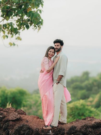 A classic portrait on a rocky outcrop with a stunning view. This is a perfect example of a destination pre-wedding shoot in the Western Ghats.
