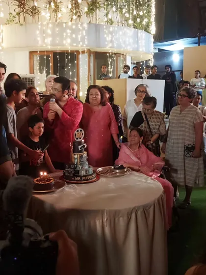 The legendary Aamir Khan addressing his guests with his spectacular movie-themed cake right beside him. It was a joy to see my creation become a centerpiece of such a special evening.