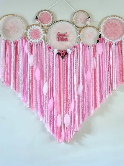 Embrace the delicate beauty of this 4-foot Pink Floral Cluster Dreamcatcher. It's a perfect statement piece for a living room, nursery, or even as a wedding backdrop.