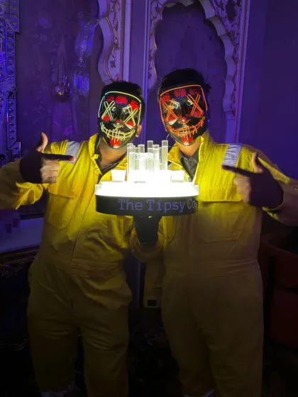 We love a good theme party. Our bartenders are dressed in 'Money Heist' style outfits with LED masks, holding a custom-lit shot tray, ready to bring some themed fun to the event.