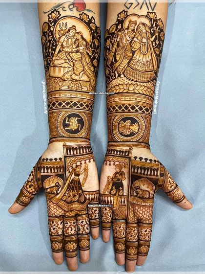A full view of a divine and dreamy bridal mehndi. This design combines portraits of gods with figures of the bride and groom, elephants, and sacred symbols like the swastika.