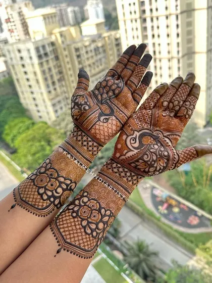 A beautiful shot of a completed bridal henna design against a city backdrop, showing how the art stands out anywhere.
