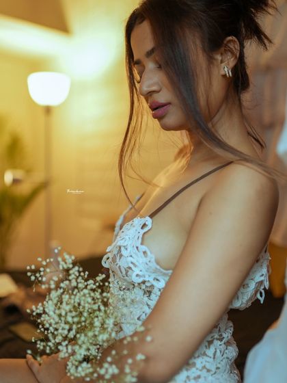 This image captures a quiet, thoughtful moment. The warm, soft lighting is perfect for creating an intimate and personal feel.