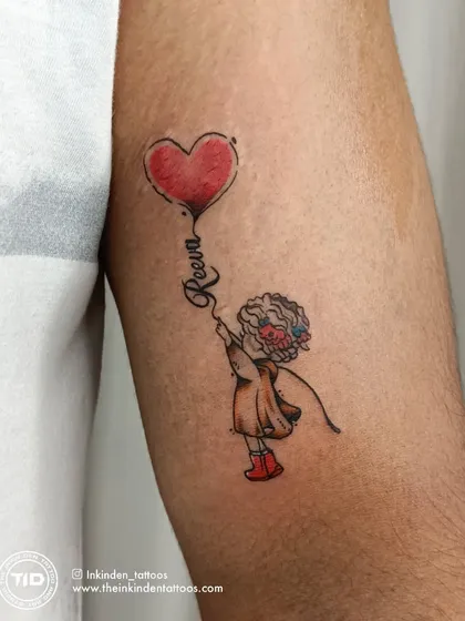 A close-up of the father-daughter balloon tattoo.