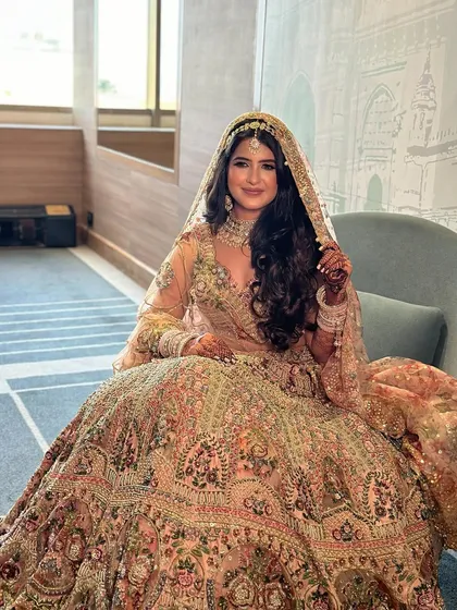The full view of Ruchita's pastel lehenga, with makeup designed to be soft, romantic, and perfectly coordinated with her outfit.