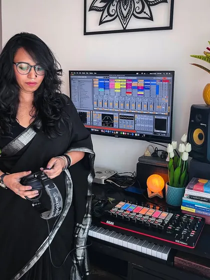 Standing in my studio, surrounded by the tools of the trade. I believe in open conversations about the industry, and in my sessions, we can discuss everything from production techniques to the realities of being a professional DJ.