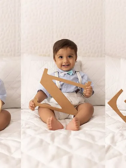 A collage showing a little boy playing with the letters O-N-E to celebrate his first birthday. A simple and personal way to mark the occasion.
