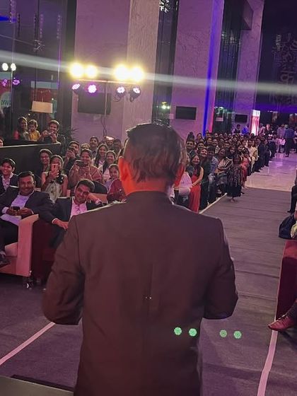 The stage is my playground, and I love interacting with the audience. Here I am at a large corporate event, bringing a volunteer from the crowd to participate in a fun and baffling trick.
