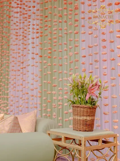 A detail of the lounge area, with a fresh lily arrangement in a cane basket.
