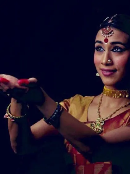 A classic portrait used for the Namaste France festival announcement. The lighting and pose are designed to capture the grace and devotion inherent in Bharatanatyam.