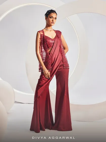 The NAIDA Sharara Saree Set, showcasing its breathtaking silhouette, intricate embroidery, and shimmering accents from a side angle.