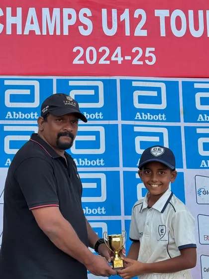 Celebrating individual contributions to a team victory. A player from my U-12 squad receives his award after our final win in the Little Champs Tournament.