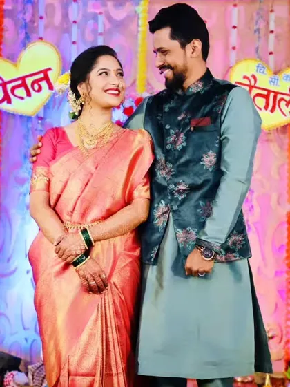 A happy couple portrait from an engagement ceremony, with the bride looking stunning in her South Indian style saree.