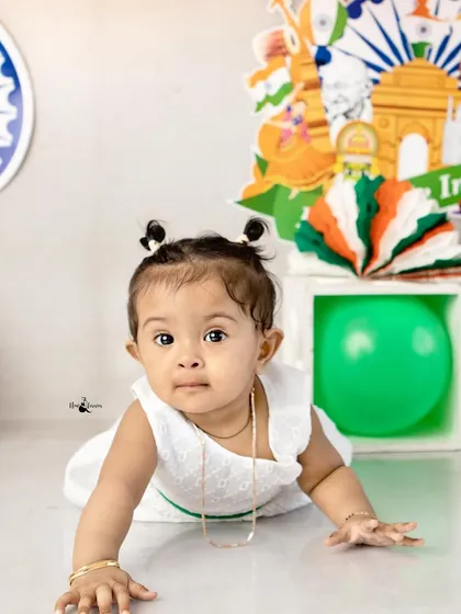 A crawling baby explores the Independence Day setup. A cute candid moment from our patriotic mini-session.
