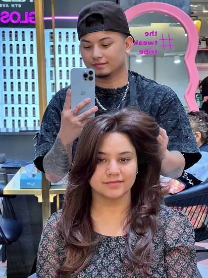 A beautiful haircut paired with a deep brown hair color. This look is classic and sophisticated, blooming with grace.