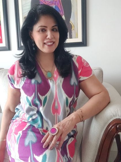 I paired the vibrant dress with turquoise jewelry, which picks up the blue-green shades in the ikat print. This is a great way to accessorize a multi-coloured outfit.