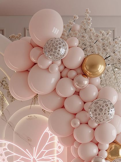 A close-up of the balloon artistry, showcasing a mix of pastel pink, chrome gold, and confetti-filled silver balloons. This detailed view highlights the quality and variety of materials I use to create rich, textured balloon garlands.