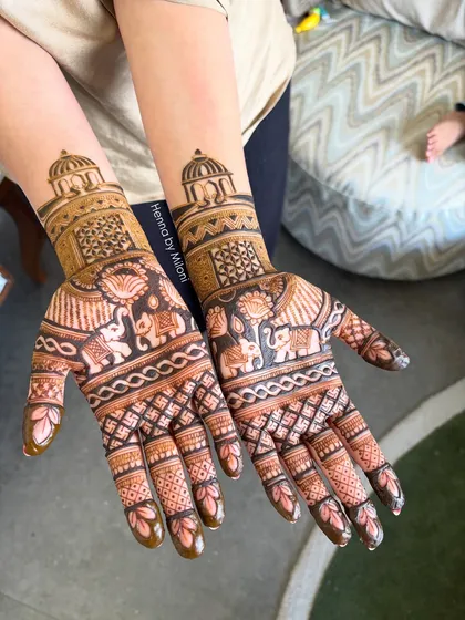 This design combines the majesty of elephants with the grandeur of palace domes. The fine line work and shading bring these traditional Indian wedding motifs to life.