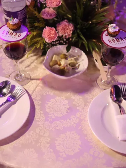 A formal table setting for a communion event. The details, like the custom-branded toppers on the wine glasses, show my commitment to personalizing every aspect of your celebration.