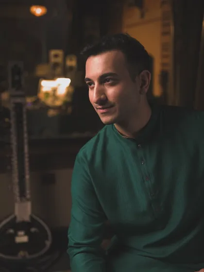 A candid moment from the 'Mastery' shoot, with my sitar in the background. It's a glimpse into my world, both on and off the stage.