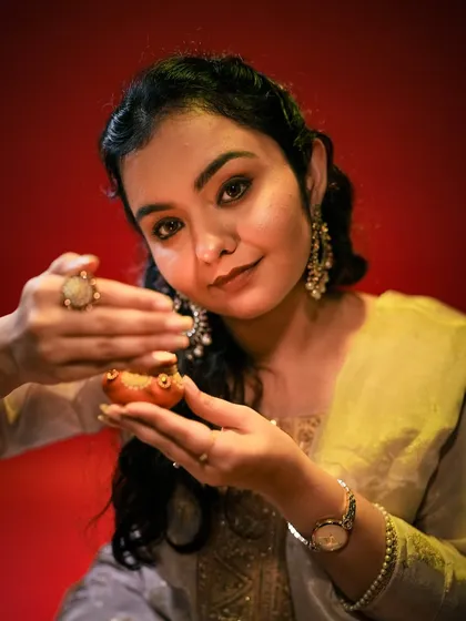 Another lovely shot from the Diwali series, capturing the warm glow of the diya.
