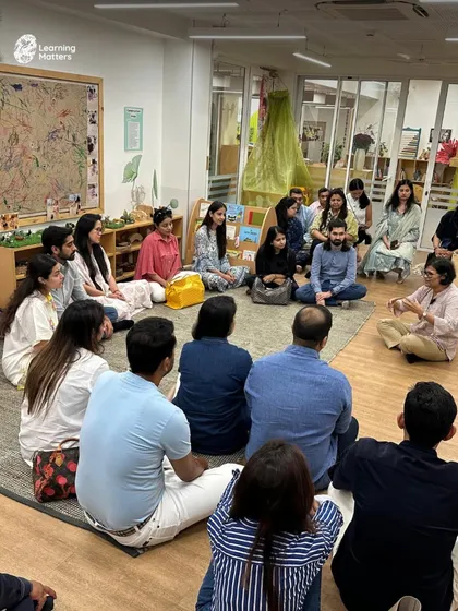 This is what our learning community looks like in action. During a parent visit, adults gather in an intimate, floor-seated circle to engage in a heart-to-heart conversation with our founder, Sonya, exploring our play-based philosophy and partnership approach.