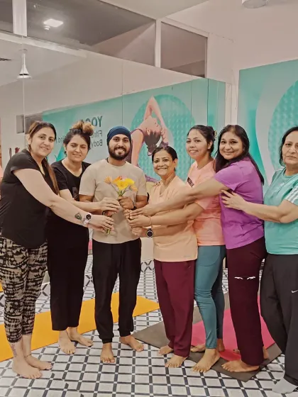 A guru is not just a teacher, but a torchbearer. This picture, taken on Guru Purnima, captures the love and respect that defines our yoga family.